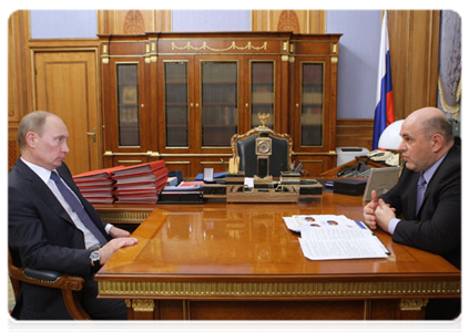 Prime Minister Vladimir Putin at a meeting with Mikhail Mishustin, head of the Federal Taxation Service