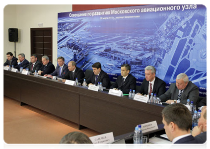 Prime Minister Vladimir Putin chairing a meeting at Sheremetyevo Airport on the development of the Moscow air traffic hub