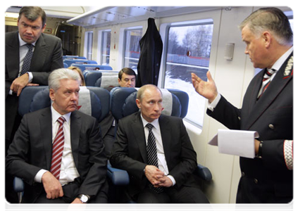 Prime Minister Vladimir Putin continues discussing the development of the Moscow air traffic hub while on a shuttle train from Sheremetyevo Airport back to Moscow