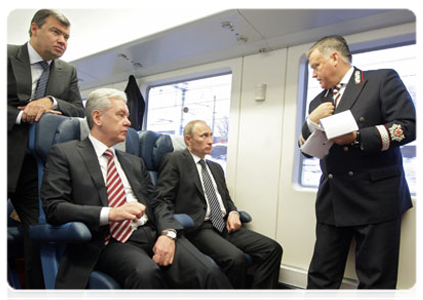 Prime Minister Vladimir Putin continues discussing the development of the Moscow air traffic hub while on a shuttle train from Sheremetyevo Airport back to Moscow