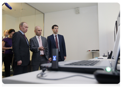 Prime Minister Vladimir Putin examines new developments in the telecommunications sector