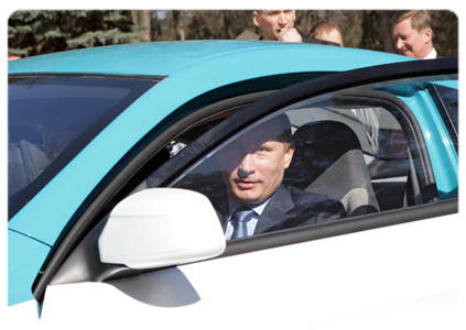 Prime Minister Vladimir Putin test-drives the new Russian Yo-Mobile