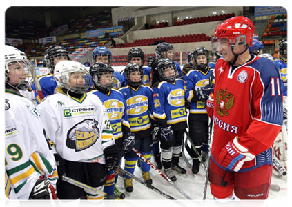 Prime Minister Vladimir Putin takes part in ice-hockey practice with young players at Luzhniki before Golden Puck Youth Hockey Finals