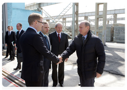 Prime Minister Vladimir Putin visiting the ZhBI-6 concrete plant where he checked out its production cycle and compared old and new equipment