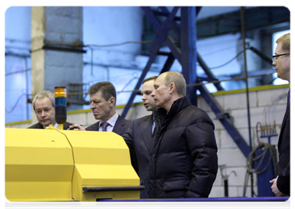 Prime Minister Vladimir Putin visiting the ZhBI-6 concrete plant where he checked out its production cycle and compared old and new equipment
