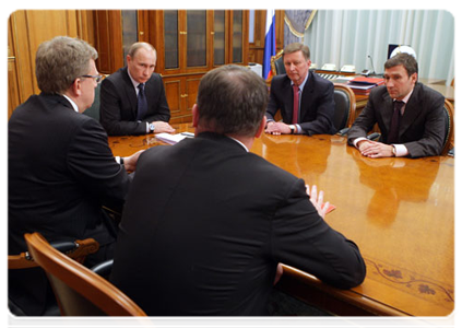 Prime Minister Vladimir Putin at a meeting with Deputy Prime Minister Sergei Ivanov, Deputy Prime Minister  and Finance Minister Alexei Kudrin, Defence Minister Anatoly Serdyukov, and Deputy Minister of Industry and Trade Andrei Dementyev