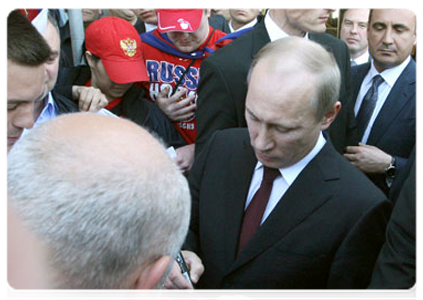 Prime Minister Vladimir Putin talking to hockey fans in Bratislava