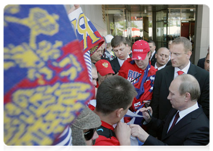 Prime Minister Vladimir Putin talking to hockey fans in Bratislava