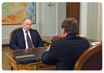 Prime Minister Vladimir Putin with head of the Federal Service for Financial Markets Dmitry Pankin