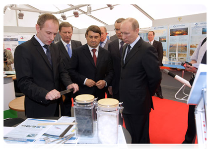 Prime Minister Vladimir Putin visits an exhibition of road-building technology and equipment