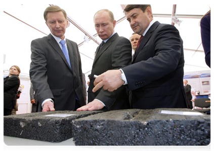Prime Minister Vladimir Putin visits an exhibition of road-building technology and equipment