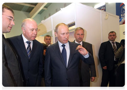 Prime Minister Vladimir Putin at the exhibition of local farming and food processing products in the village of Atemar during trip to Mordovia