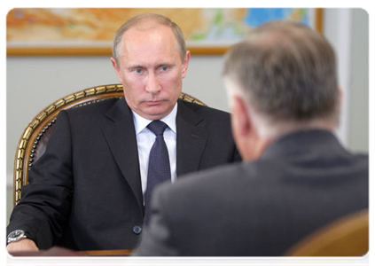 Prime Minister Vladimir Putin at a meeting with Russian Railways CEO Vladimir Yakunin