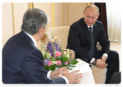Prime Minister Vladimir Putin with Kassym-Jomart Tokayev, director-general of the United Nations Office at Geneva