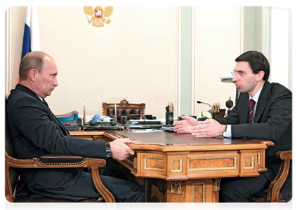 Prime Minister Vladimir Putin with Minister of Communications and Mass Media Igor Shchegolev