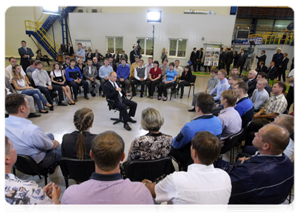 Prime Minister Vladimir Putin talking with workers at Magnitogorsk Iron & Steel Works