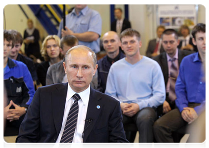 Prime Minister Vladimir Putin talking with workers at Magnitogorsk Iron & Steel Works