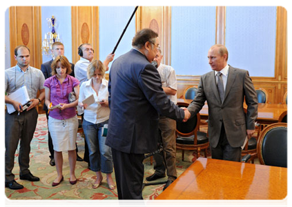 Prime Minister Vladimir Putin at a meeting with Kemerovo Region Governor Aman Tuleyev