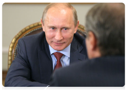 Prime Minister Vladimir Putin at a meeting with Sberbank head German Gref
