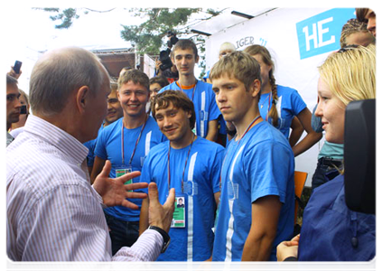 Prime Minister Vladimir Putin visits booths and speaks with participants at the Seliger-2011 International Youth Forum