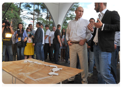 Prime Minister Vladimir Putin visits booths and speaks with participants at the Seliger-2011 International Youth Forum