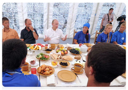 Prime Minister Vladimir Putin speaking with scientists and archaeology students working on the excavation of the ancient Greek city of Phanagoria