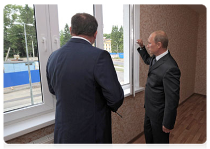 Prime Minister Vladimir Putin visiting the Osinovaya Roshcha neighbourhood