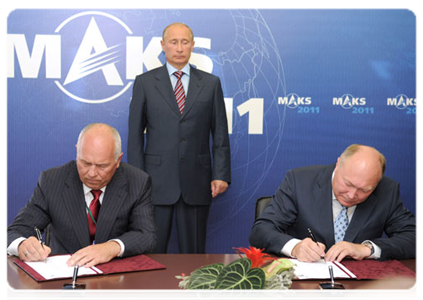 Prime Minister Vladimir Putin attends a contract-signing ceremony at the MAKS international air show