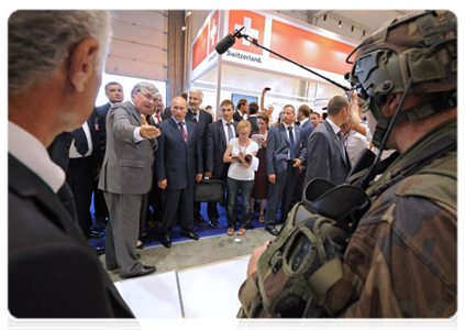 Prime Minister Vladimir Putin examines the latest pilot equipment at the Safran Co stand