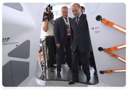 Prime Minister Vladimir Putin tours the MAKS 2011 international air show, showcasing the latest in aerospace technology produced by Russian and foreign companies