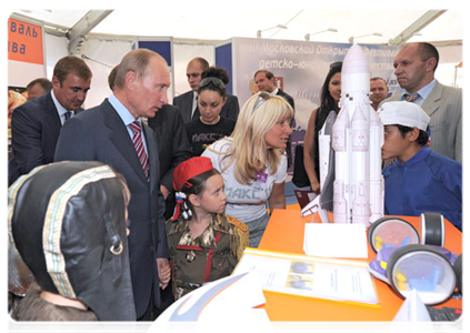 Prime Minister Vladimir Putin at a pavilion representing an open festival of children's creative endeavours in Moscow, called Clear Prop