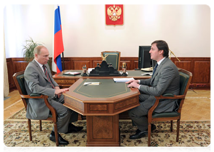 Prime Minister Vladimir Putin meets with Russian Agricultural Bank CEO Dmitry Patrushev
