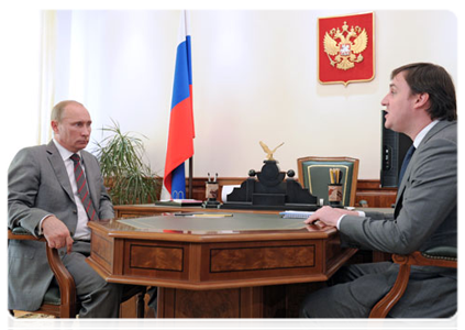 Prime Minister Vladimir Putin meets with Russian Agricultural Bank CEO Dmitry Patrushev