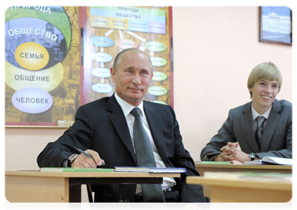 Prime Minister Vladimir Putin visits with an 11th-year social science class at Podolsk