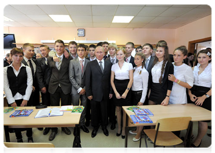 Prime Minister Vladimir Putin visits with an 11th-year social science class at Podolsk