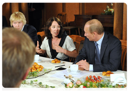 Vladimir Putin talking to young actors and theatre directors during his visit to the State Theatre of Nations