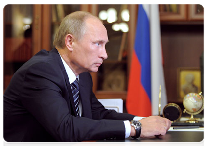 Prime Minister Vladimir Putin at a working meeting with the governor of the Arkhangelsk Region Ilya Mikhalchuk