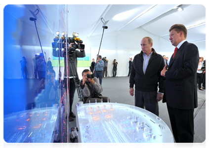 Prime Minister Vladimir Putin at a meeting with Gazprom CEO Alexei Miller following the launch of the Nord Stream pipeline