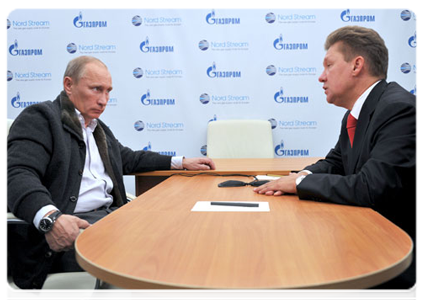 Prime Minister Vladimir Putin at a meeting with Gazprom CEO Alexei Miller following the launch of the Nord Stream pipeline
