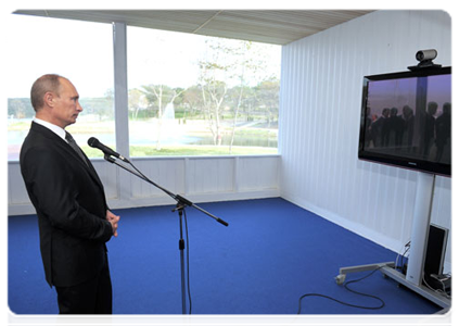 Prime Minister Vladimir Putin holds a videoconference with the village of Vitim in the area of the Talakan oil and gas condensate field in Yakutia during his trip to Russky Island
