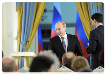 Prime Minister Vladimir Putin and Minister of Communications and Mass Media Igor Shchegolev
