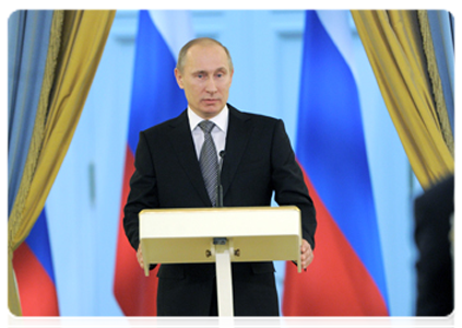 Prime Minister Vladimir Putin takes part in the presentation ceremony for the 2011 government print media awards
