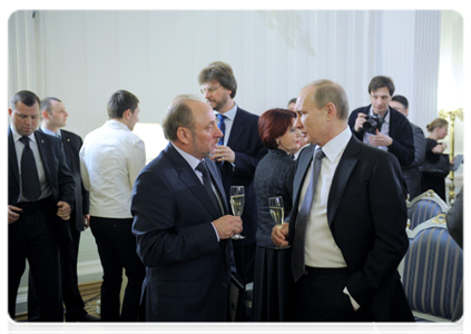 Prime Minister Vladimir Putin and Editor-in-Chief of the Novye Izvestia newspaper Valery Yakov