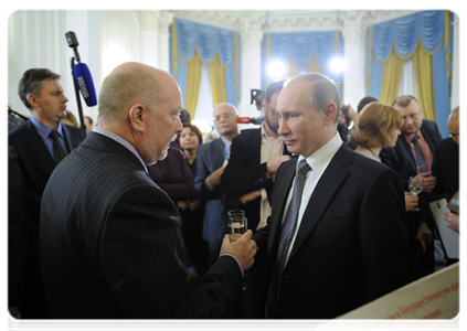 Prime Minister Vladimir Putin and Editor-in-Chief of the Tribuna newspaper Oleg Kuzin