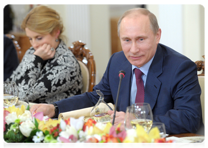 Prime Minister Vladimir Putin and RIA Novosti editor-in-chief Svetlana Mironyuk