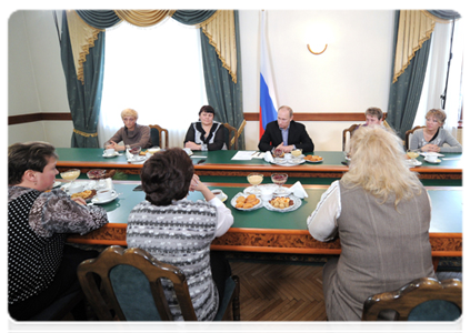 Prime Minister Vladimir Putin meets with the widows of the miners killed in the Raspadskaya mine explosions