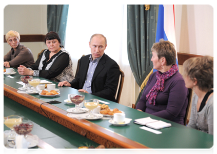 Prime Minister Vladimir Putin meets with the widows of the miners killed in the Raspadskaya mine explosions