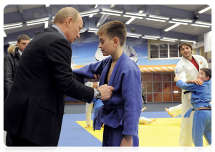 Prime Minister Vladimir Putin attends a class of young judo students during a visit to the Regional Judo Centre in Kemerovo
