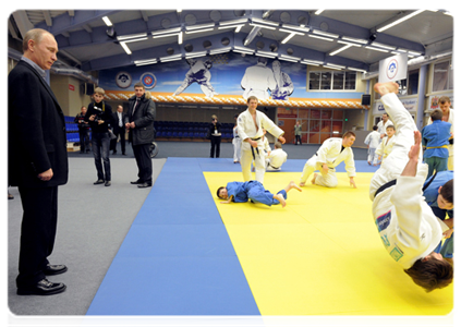 Prime Minister Vladimir Putin attends a class of young judo students during a visit to the Regional Judo Centre in Kemerovo