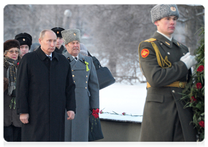 Prime Minister Vladimir Putin visits the Piskaryovskoye memorial cemetery and lays a wreath at the Motherland bronze sculpture